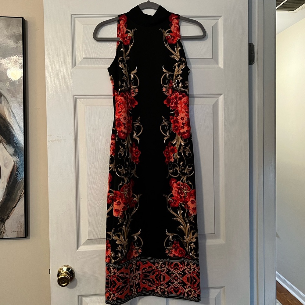 Knee length, fitted dress. From Express. Size XS. NEVER WORN, tags still on.